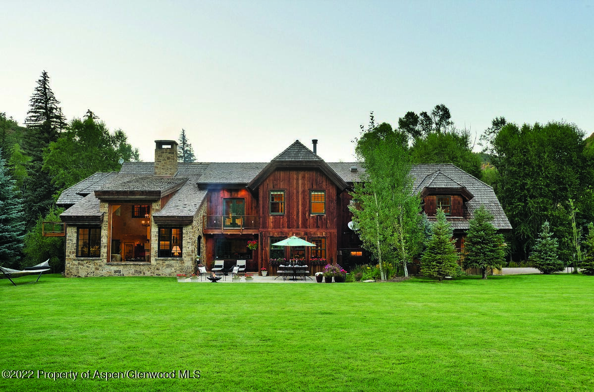 333 Snowmass Creek Road Snowmass, CO 81654 - Photo 30 of 41 a front view of a house with a garden