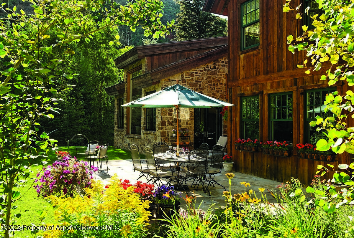 333 Snowmass Creek Road Snowmass, CO 81654 - Photo 36 of 41 front view of a house with a yard
