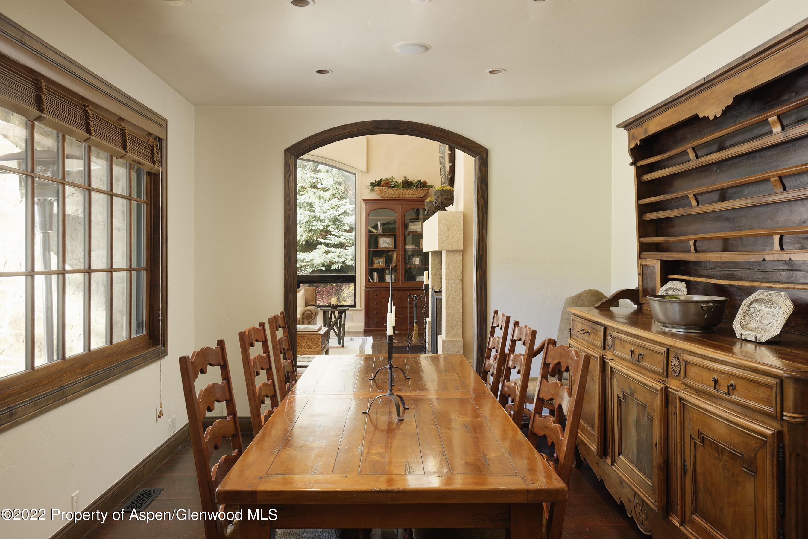 333 Snowmass Creek Road Snowmass, CO 81654 - Photo 7 of 41 a view of a dining room with furniture window and wooden floor