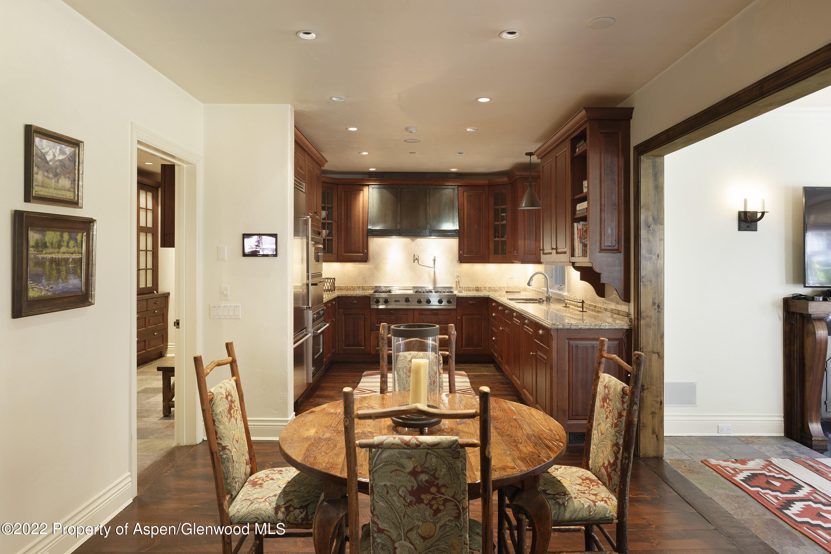 333 Snowmass Creek Road Snowmass, CO 81654 - Photo 8 of 41 a dining room with furniture and wooden floor
