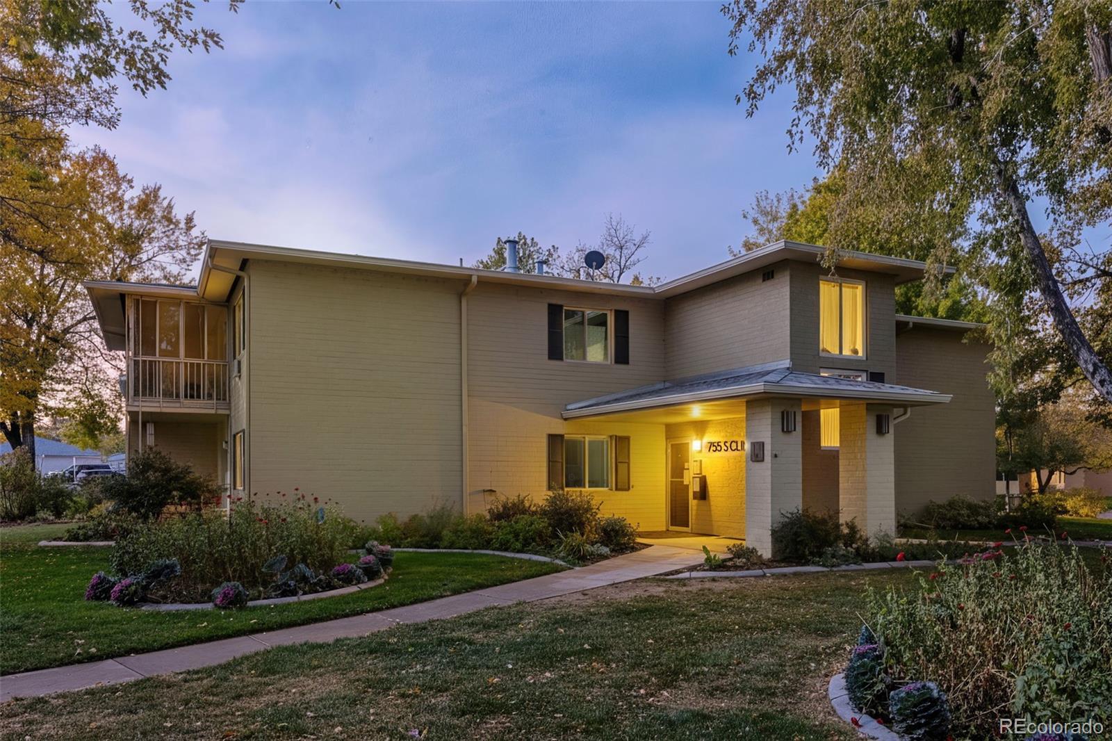 755 South Clinton Street, Unit 7B Denver, CO 80247 - Photo 1 of 36 a front view of a house with garden