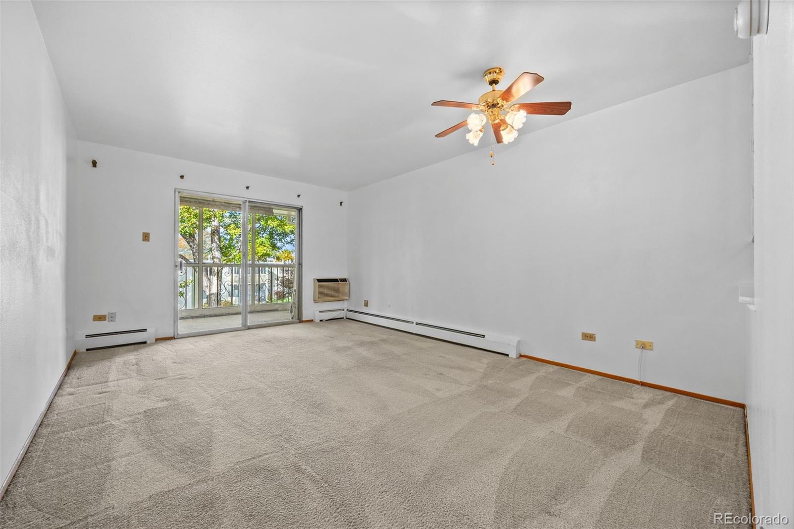 755 South Clinton Street, Unit 7B Denver, CO 80247 - Photo 11 of 36 an empty room with window