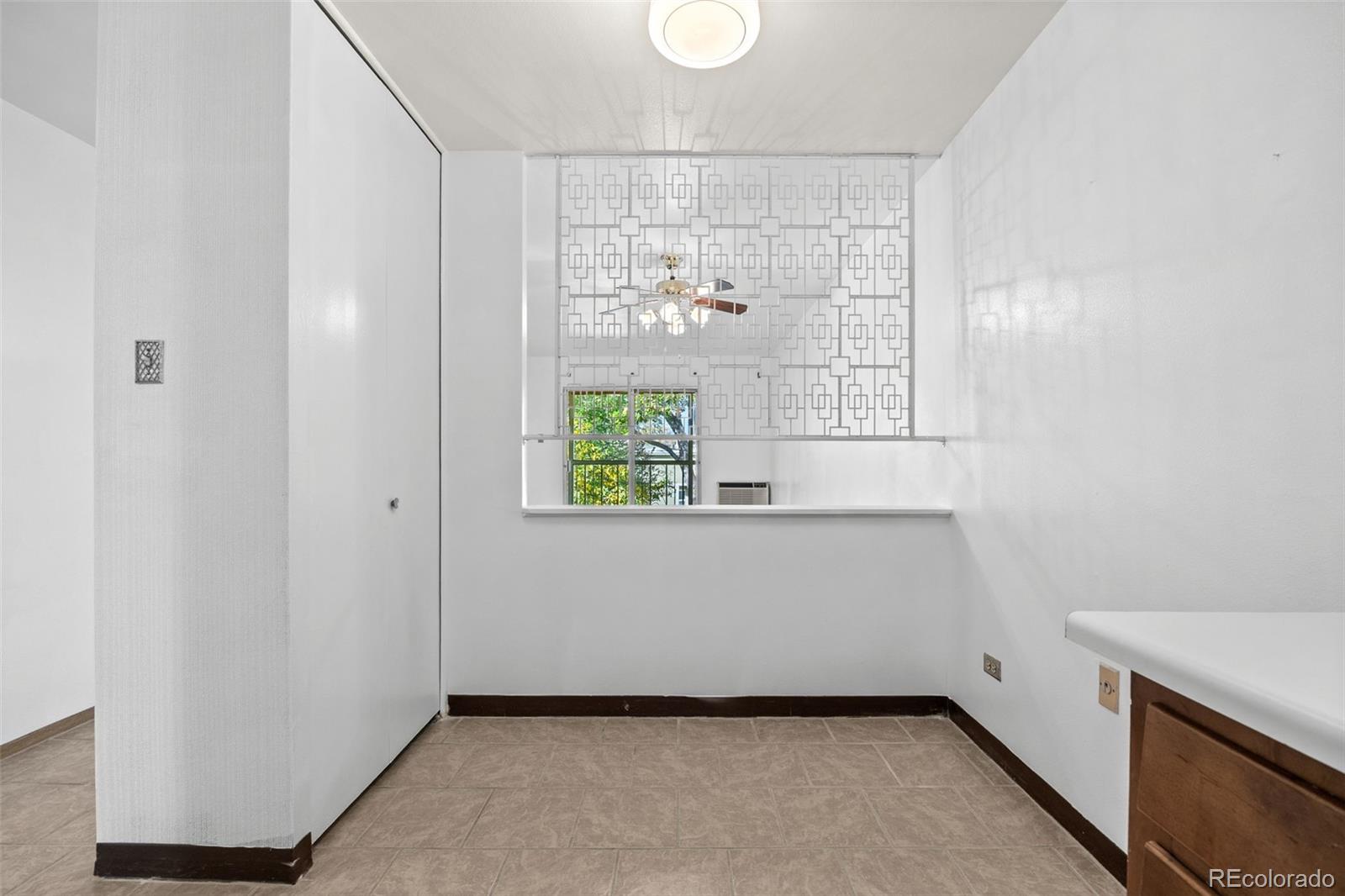 755 South Clinton Street, Unit 7B Denver, CO 80247 - Photo 15 of 36 a view of an empty room with a window