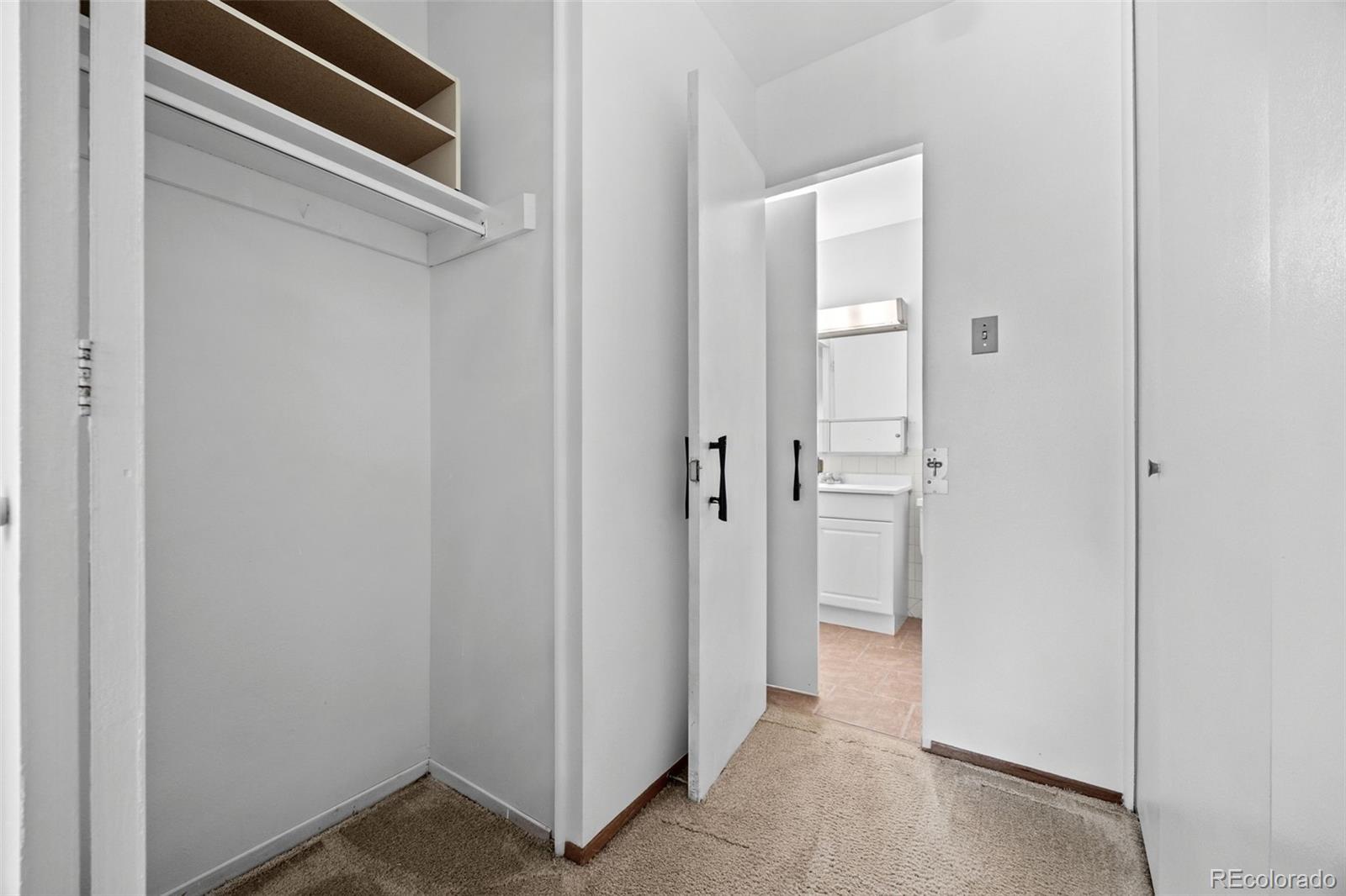 755 South Clinton Street, Unit 7B Denver, CO 80247 - Photo 21 of 36 a view of a hallway with closet