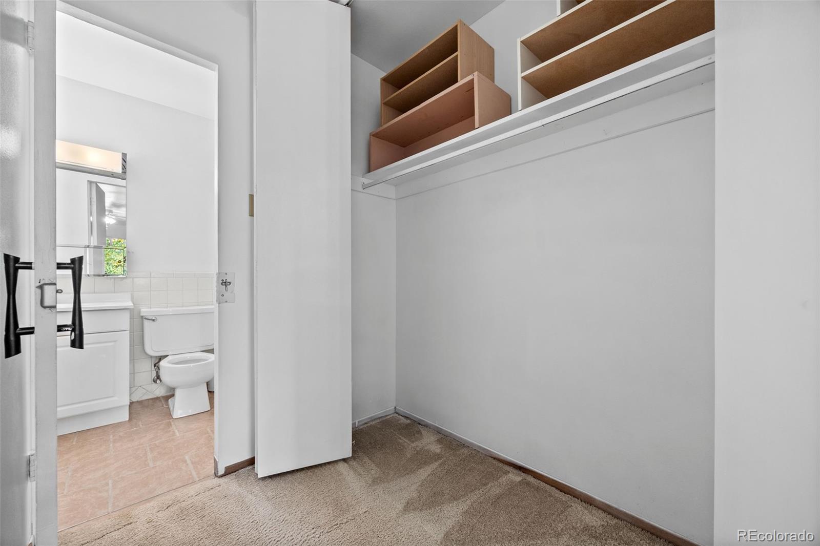 755 South Clinton Street, Unit 7B Denver, CO 80247 - Photo 22 of 36 a view of a bathroom with a toilet