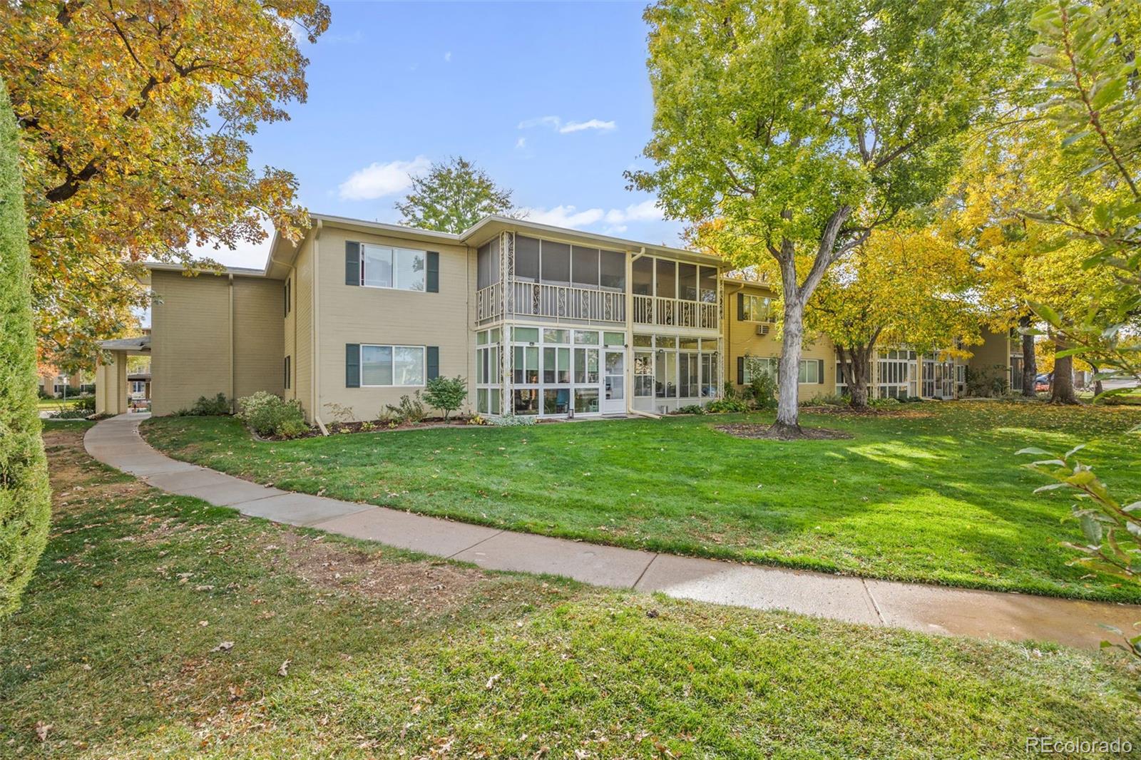 755 South Clinton Street, Unit 7B Denver, CO 80247 - Photo 27 of 36 a view of a house with a yard