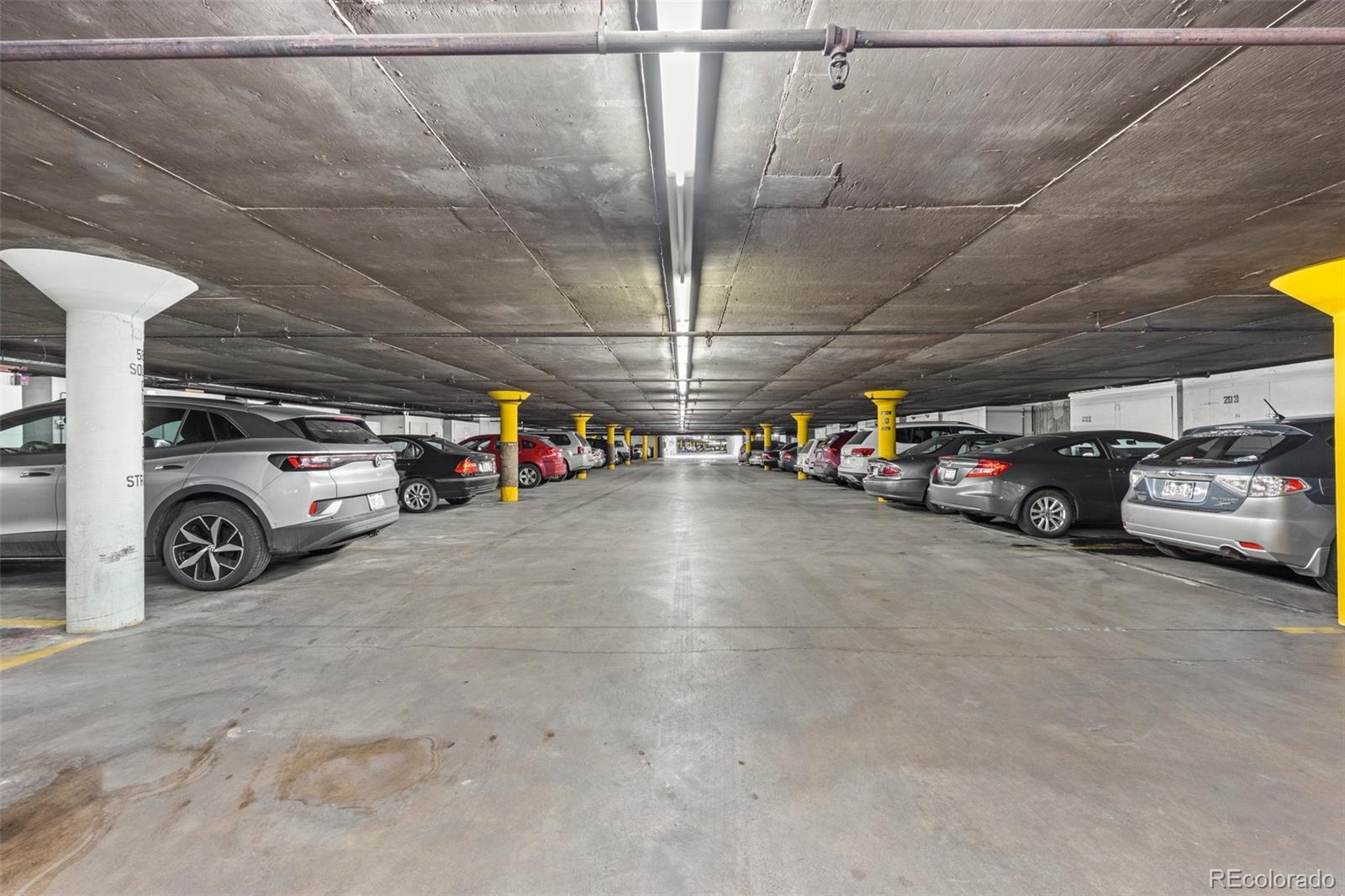 755 South Clinton Street, Unit 7B Denver, CO 80247 - Photo 34 of 36 a view of parking garage with cars