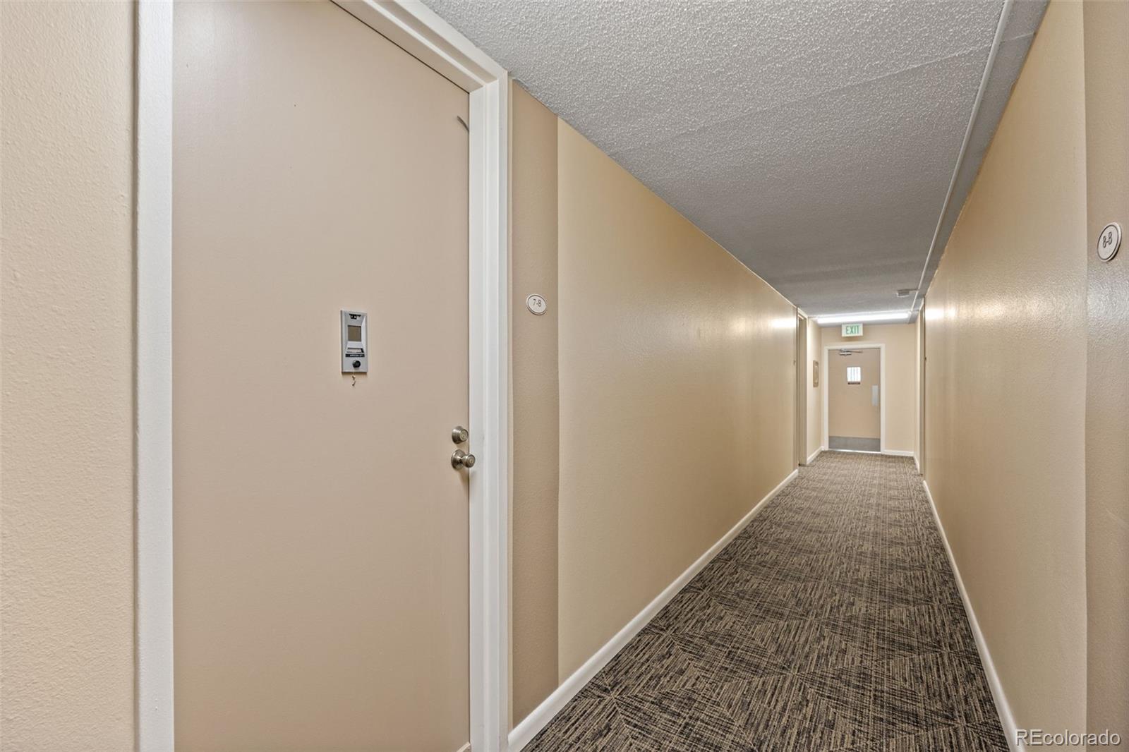 755 South Clinton Street, Unit 7B Denver, CO 80247 - Photo 7 of 36 a view of hallway with stairs