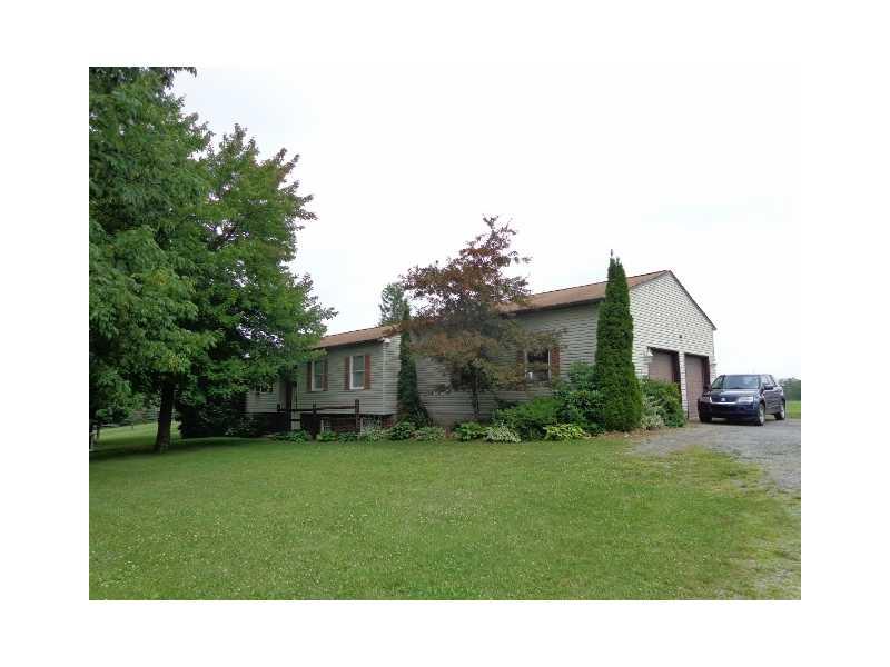 Exterior Front. situated on 2.03 cleared and level acres, 23 yr old split entry all electic home with in room climate control. 2x6 construction, insulated, plaster walls, 30x40 mechanic s attached garage(built 1995) with 20 ft high ceiling. Spacious eat in kitchen
