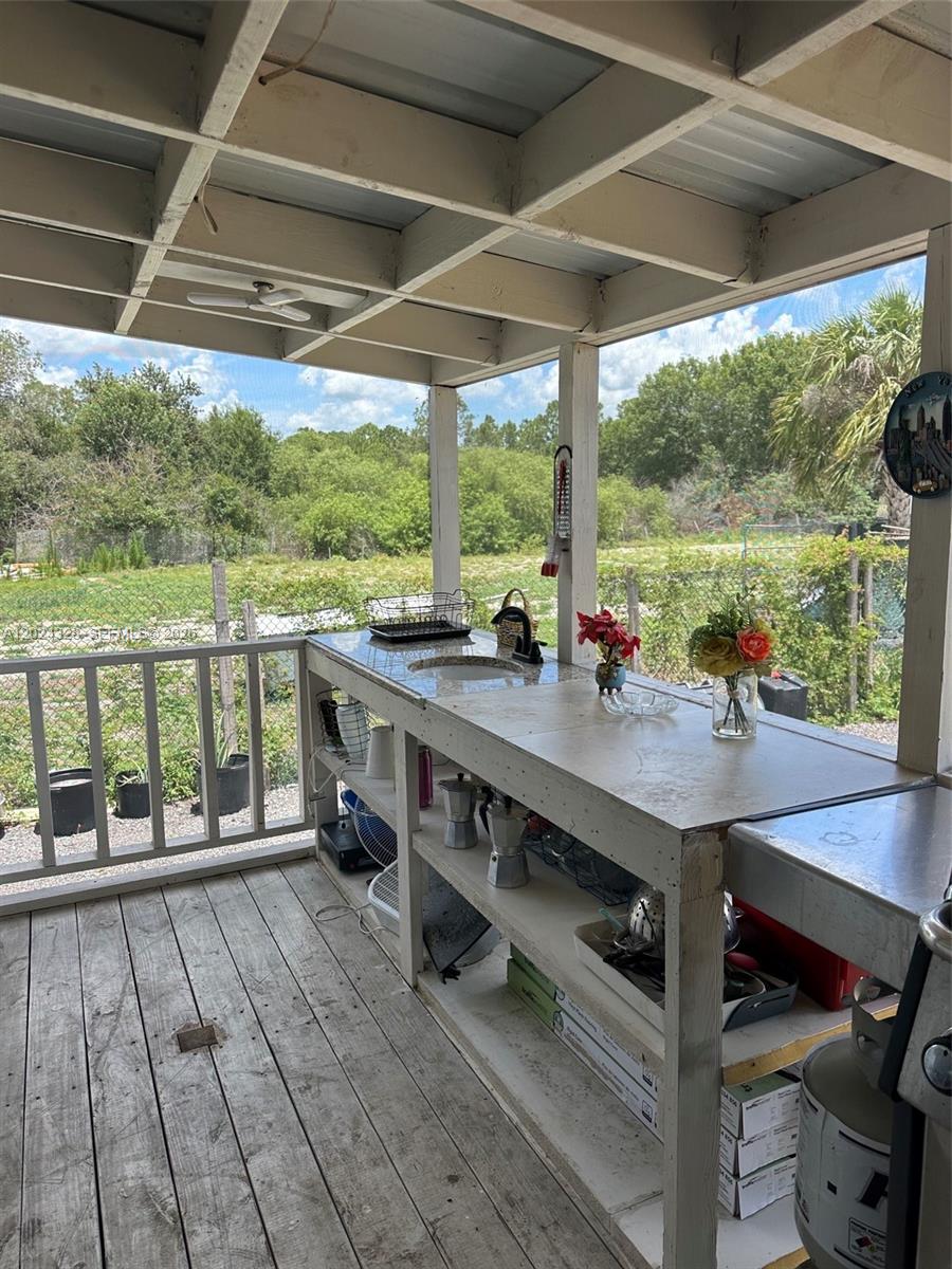 625 North Quebrada Street Clewiston, FL 33440 - Photo 18 of 26 a view of a patio with wooden floor