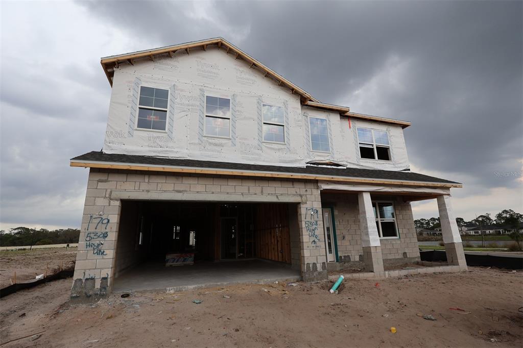 5308 High Line Drive St. Cloud, FL 34771 - Photo 1 of 18 a front view of a house with garden