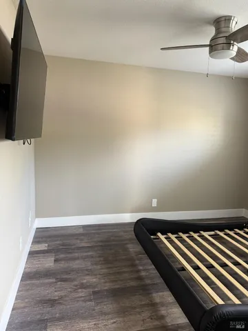 a view of a room with wooden floor and chair
