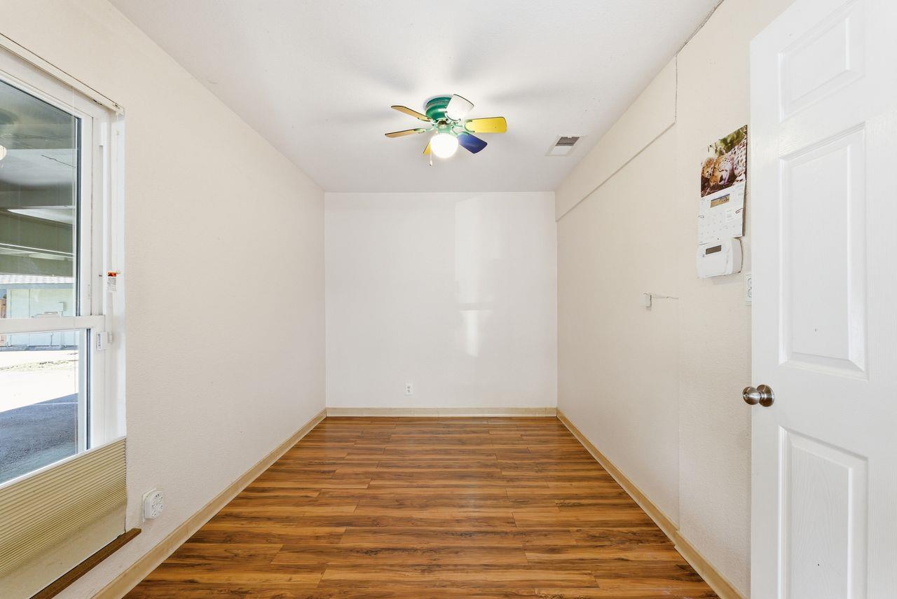 5561 Roundtree Common Fremont, CA 94538 - Photo 5 of 29 a view of a hallway with wooden floor