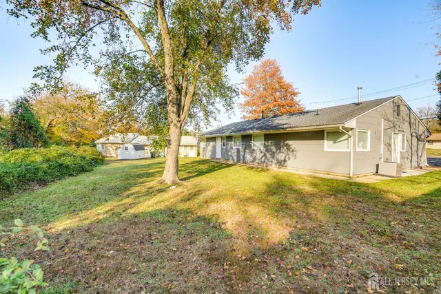 a view of a house with pool and yard