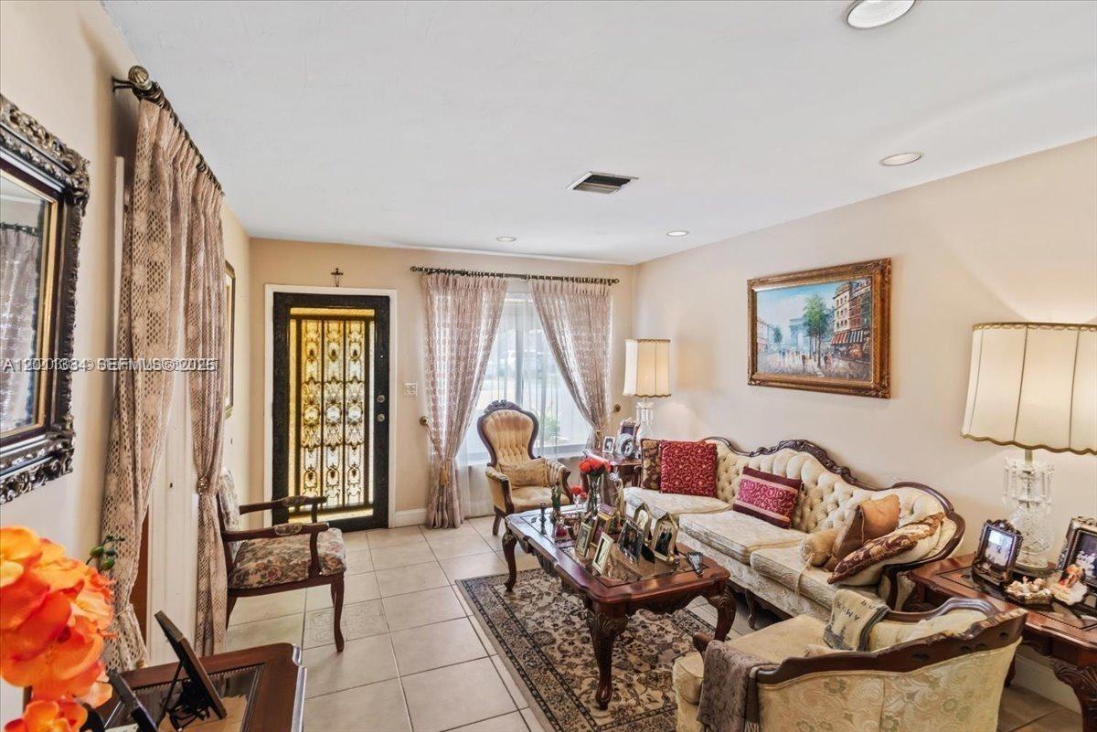 6385 Southwest 25th Street Miami, FL 33155 - Photo 5 of 28 a living room with furniture and a window
