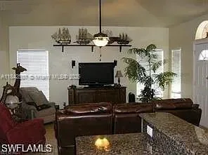 a kitchen with a refrigerator and a stove top oven
