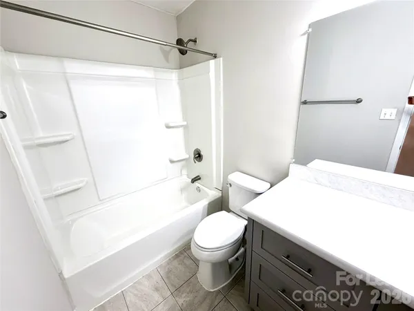 a bathroom with a sink a toilet and a bathtub
