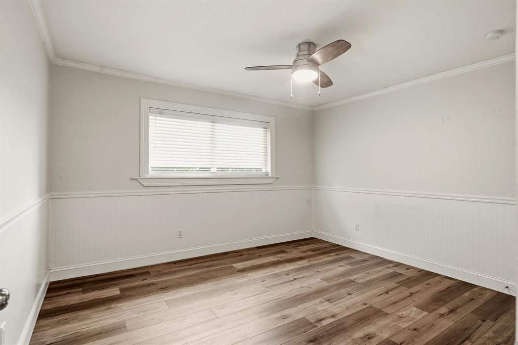 7354 Walling Lane Dallas, TX 75231 - Photo 21 of 28 wooden floor in an empty room with a window