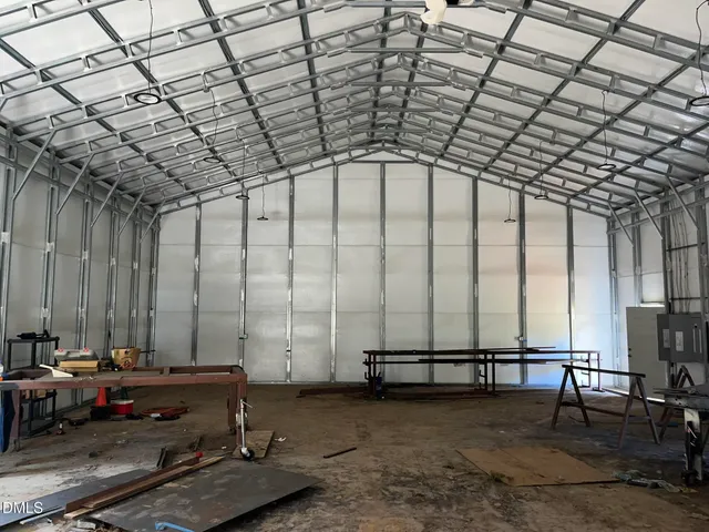 a view of a house with a yard and garage