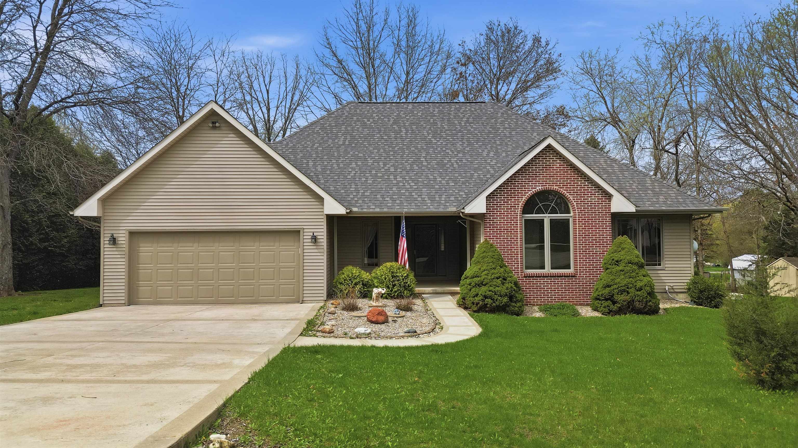307 Portage Lane Dixon, IL 61021 - Photo 1 of 38 a front view of a house with a yard and garage