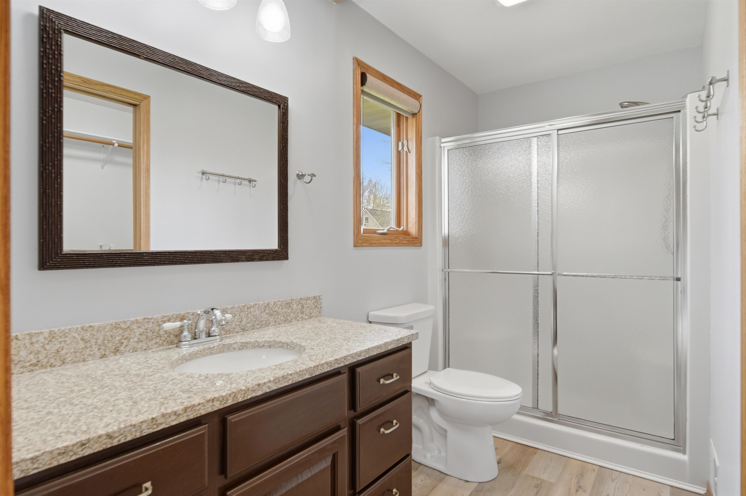 307 Portage Lane Dixon, IL 61021 - Photo 16 of 38 a bathroom with a granite countertop sink toilet and shower