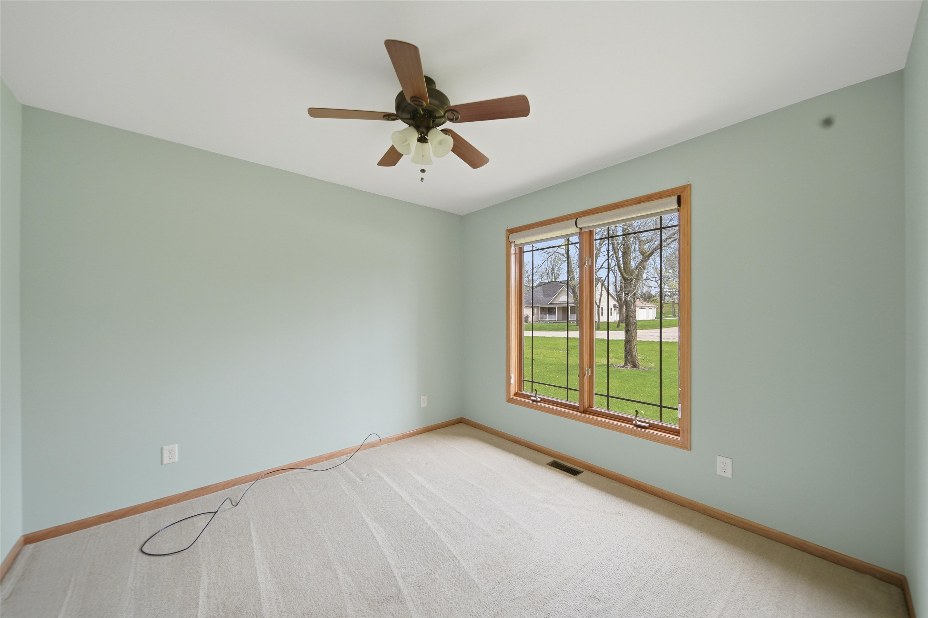 307 Portage Lane Dixon, IL 61021 - Photo 19 of 38 a view of a livingroom with a ceiling fan and window