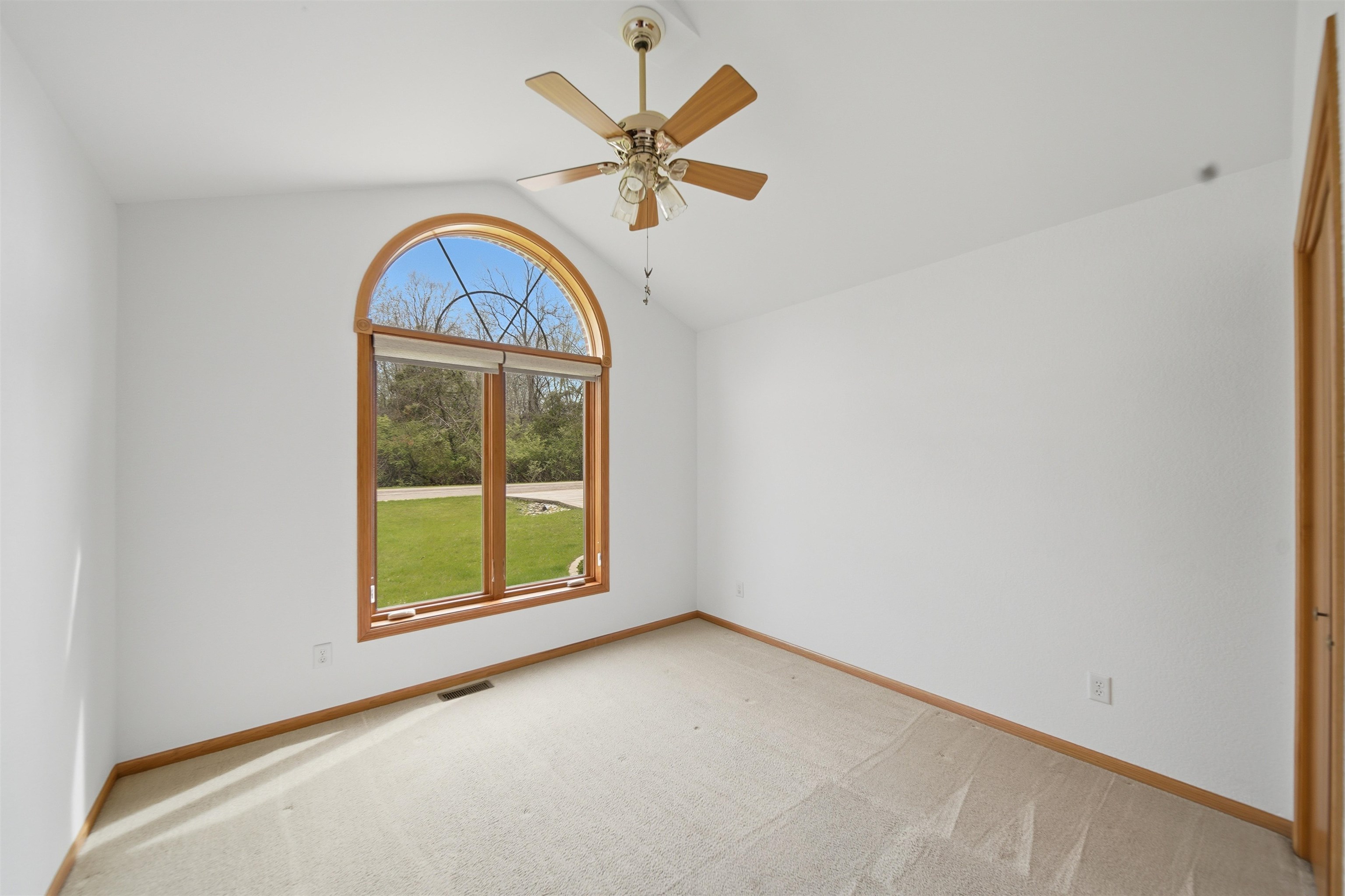 307 Portage Lane Dixon, IL 61021 - Photo 21 of 38 an empty room with ceiling fan and windows