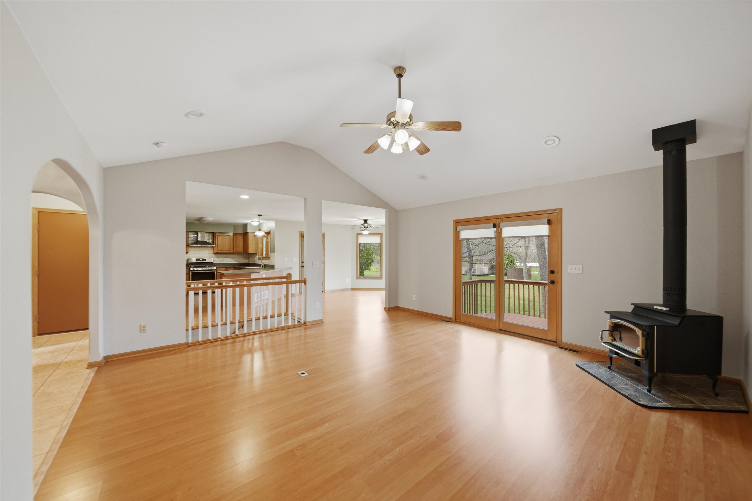 307 Portage Lane Dixon, IL 61021 - Photo 4 of 38 a view of a livingroom with wooden floor and a ceiling fan