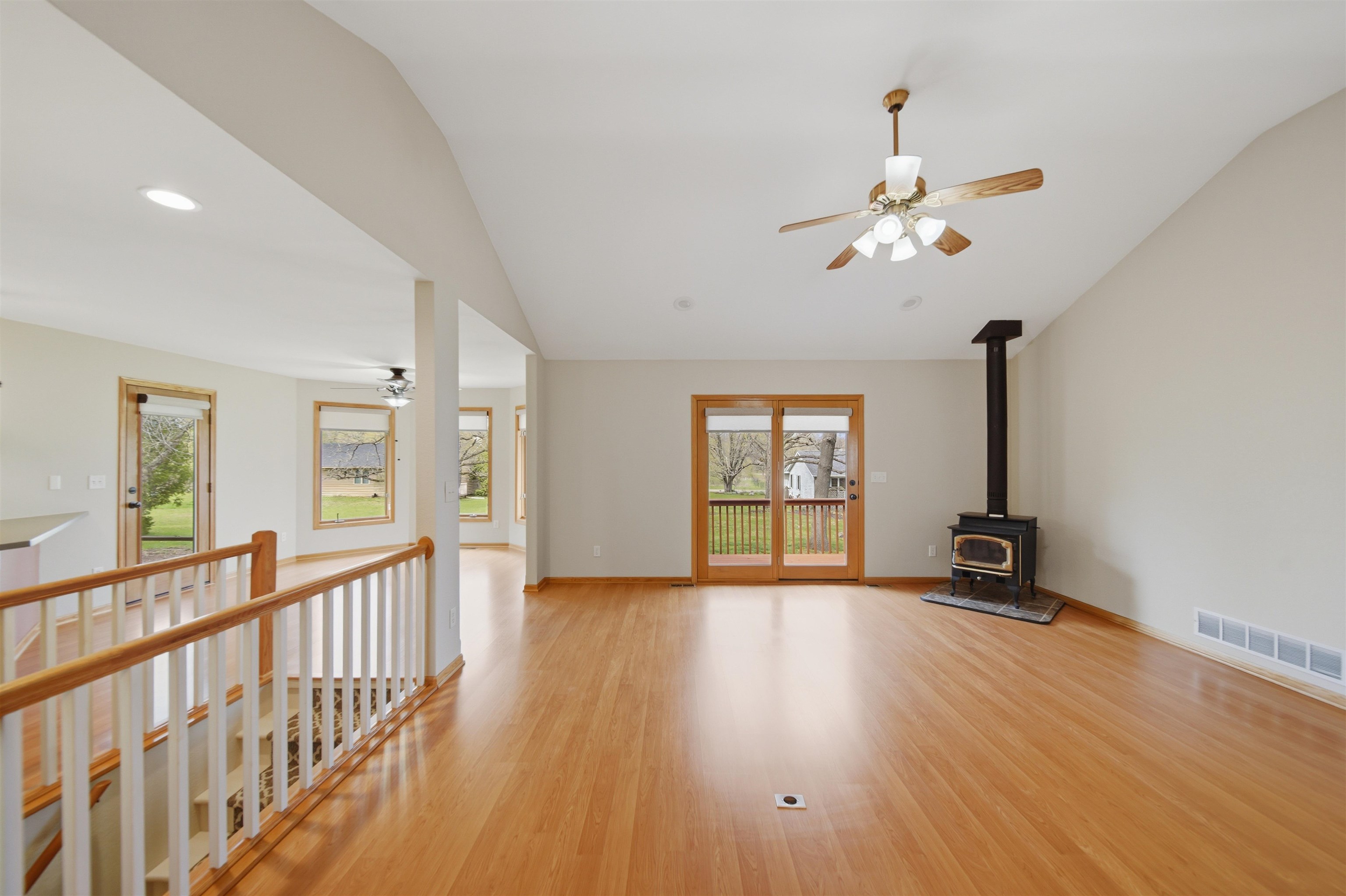 307 Portage Lane Dixon, IL 61021 - Photo 8 of 38 a view of an empty room with a window and wooden floor