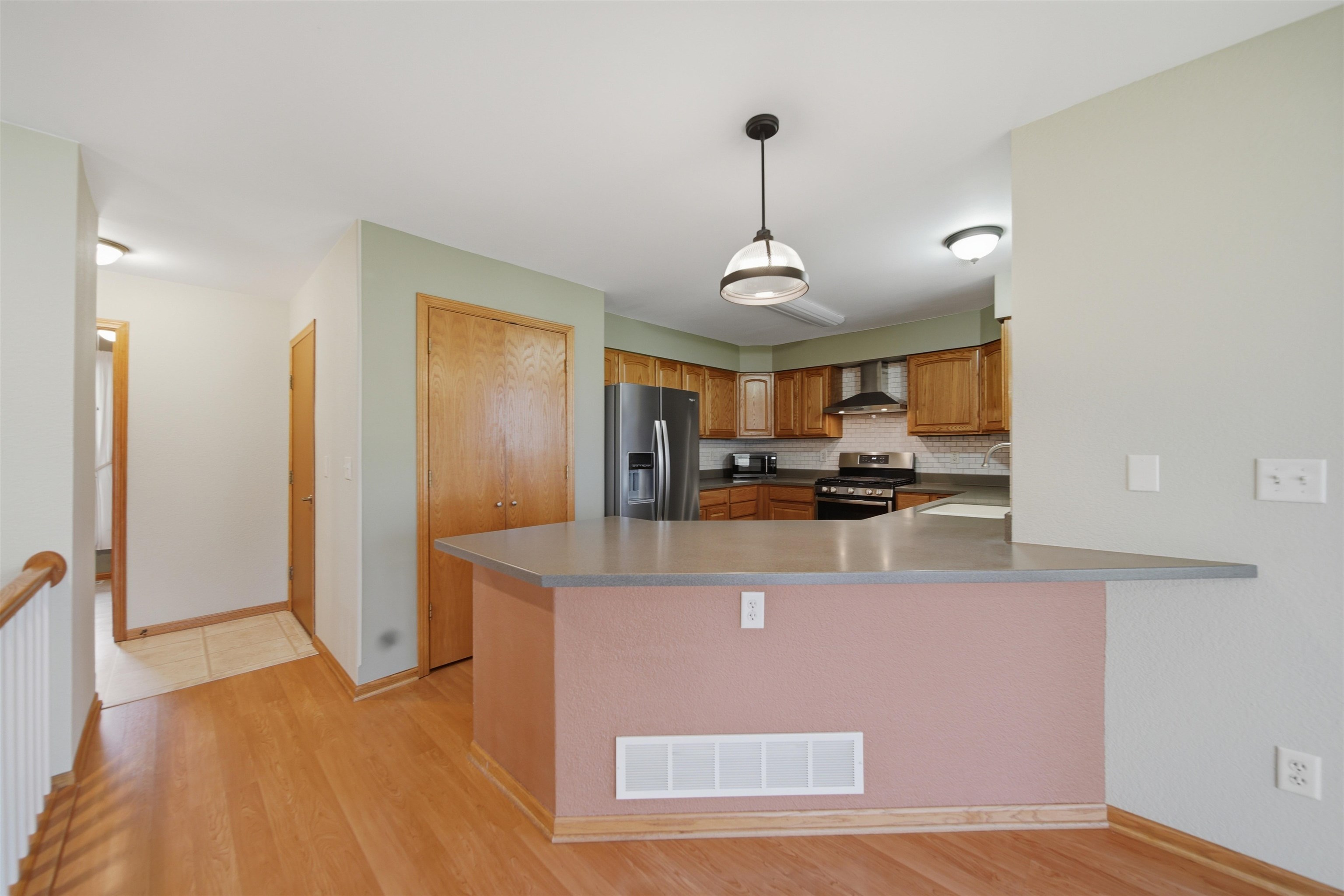 307 Portage Lane Dixon, IL 61021 - Photo 10 of 38 a view of a kitchen with stainless steel appliances granite countertop a sink and refrigerator