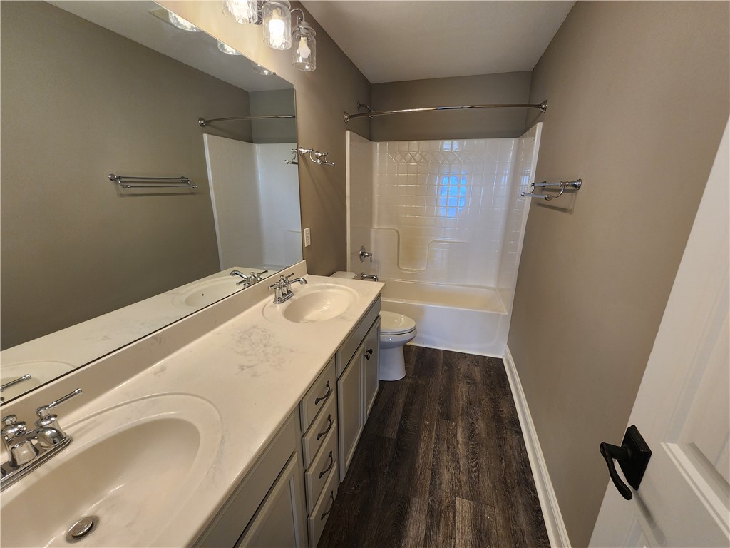 7441 Dodson Road Brookville, OH 45309 - Photo 35 of 50 This bathroom features a double vanity and sleek fixtures for a clean aesthetic.