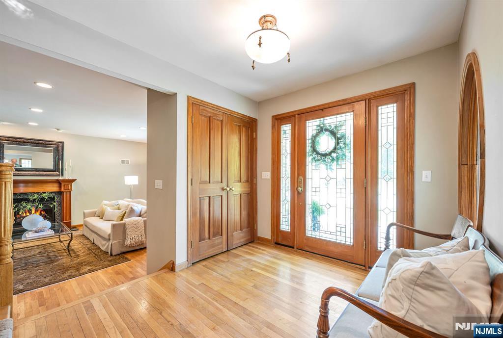 411 Snyder Road Wyckoff, NJ 07481 - Photo 3 of 36 a bedroom with furniture and large windows