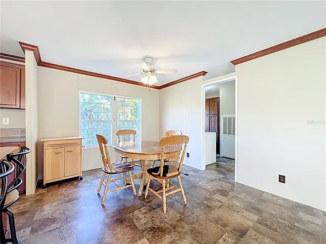 a dining room with furniture and wooden floor