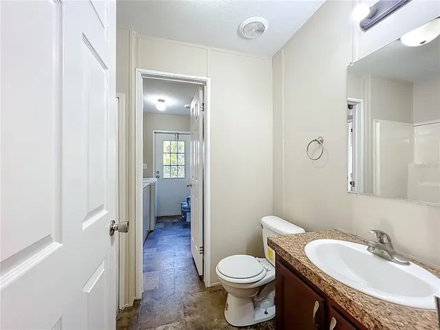 a bathroom with a sink a mirror and a bathtub