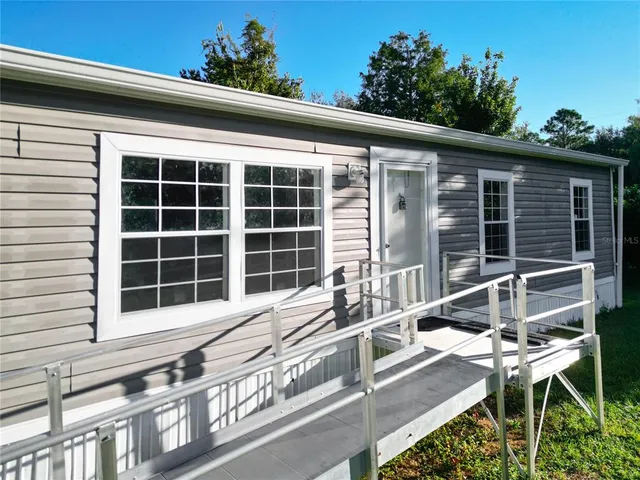 a front view of a house with a large window