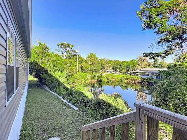 a view of a lake with a garden