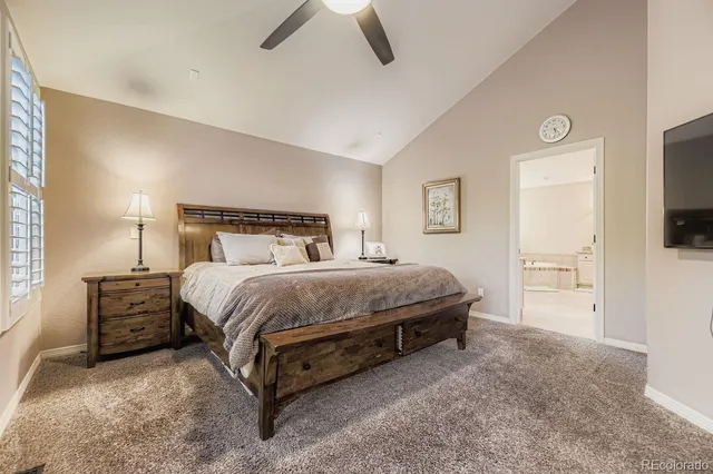 a spacious bedroom with a bed and furniture