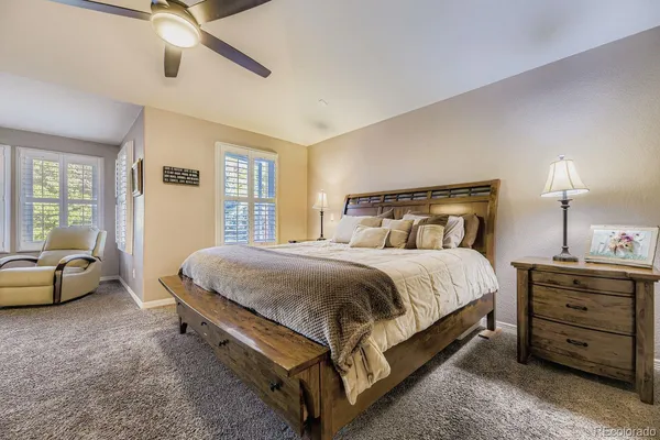 a spacious bathroom with a tub sink and mirror