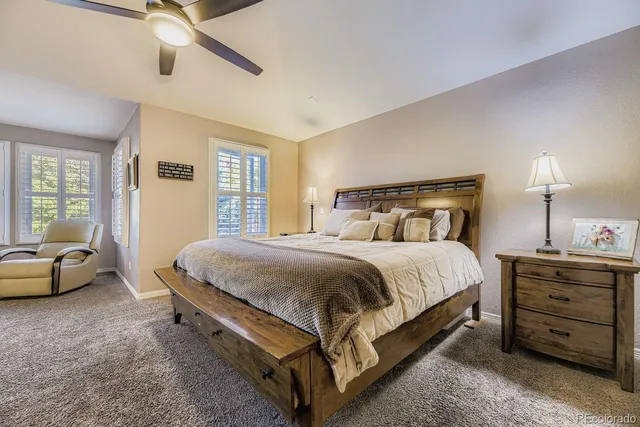 a spacious bathroom with a tub sink and mirror