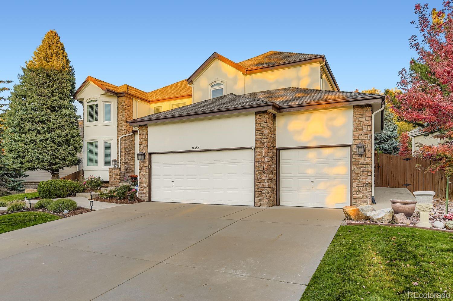 8356 Green Island Circle Lone Tree, CO 80124 - Photo 3 of 30 a view of a house with a yard
