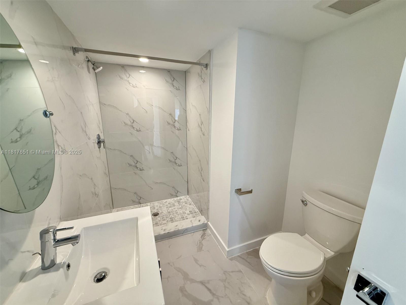 1552 Euclid Avenue, Unit 6 Miami Beach, FL 33139 - Photo 3 of 8 a bathroom with a sink a toilet and shower