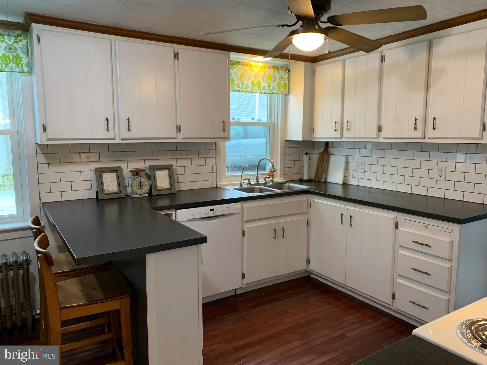 3317 River Road Conestoga, PA 17516 - Photo 2 of 33 a kitchen with stainless steel appliances granite countertop a sink a stove and white cabinets