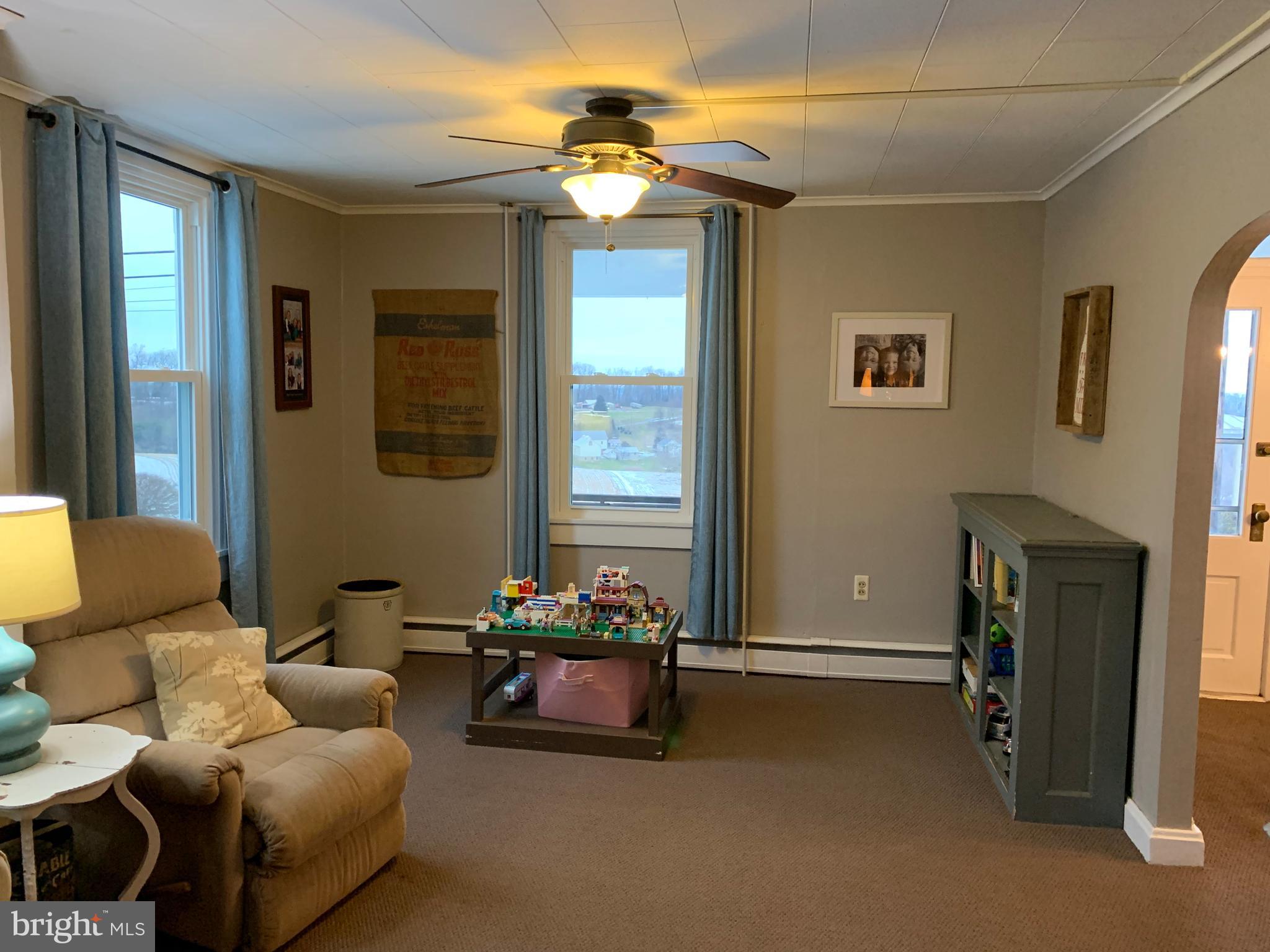 3317 River Road Conestoga, PA 17516 - Photo 11 of 33 a living room with furniture and a chandelier