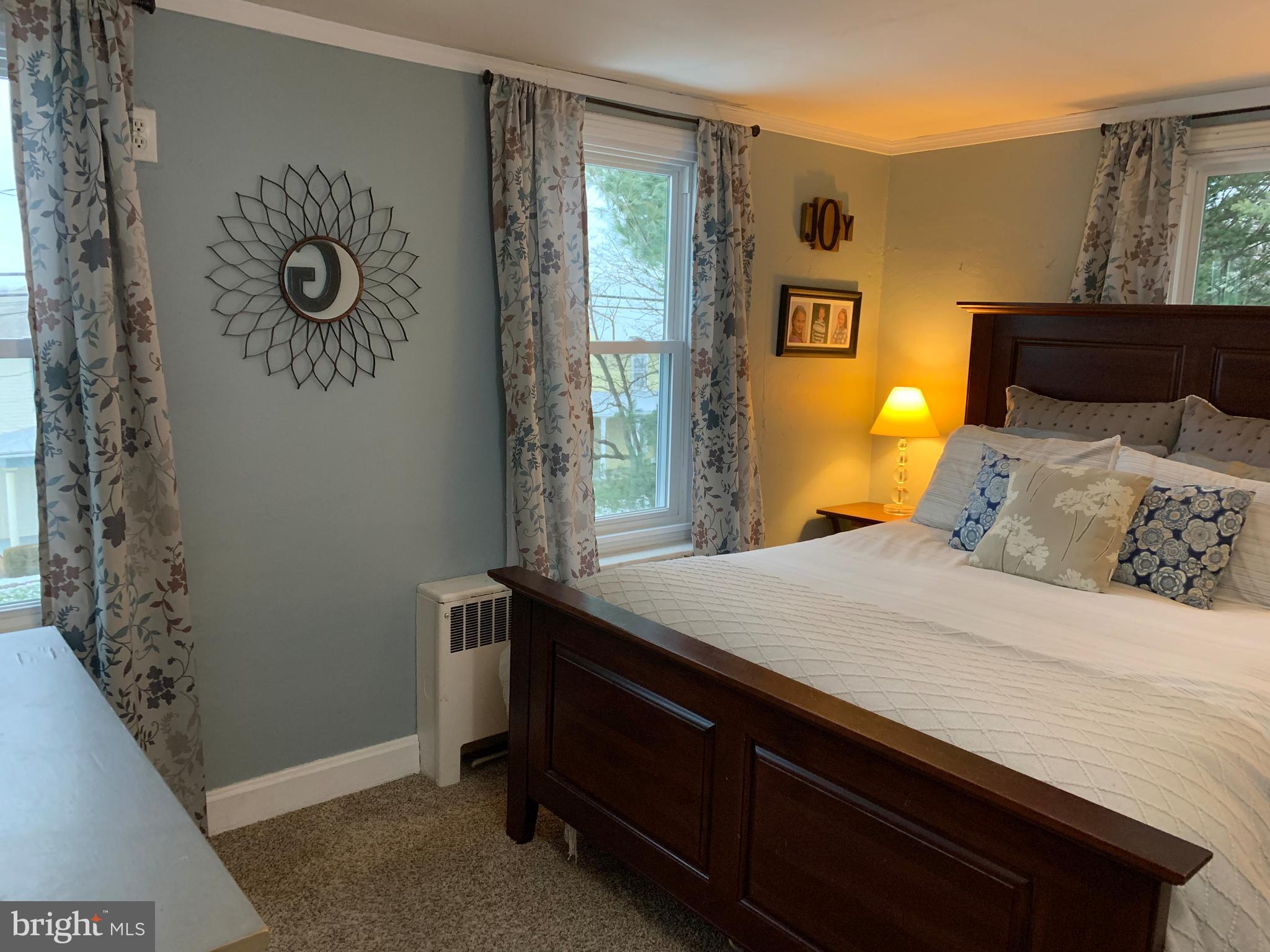 3317 River Road Conestoga, PA 17516 - Photo 12 of 33 a bedroom with a bed and wooden floor