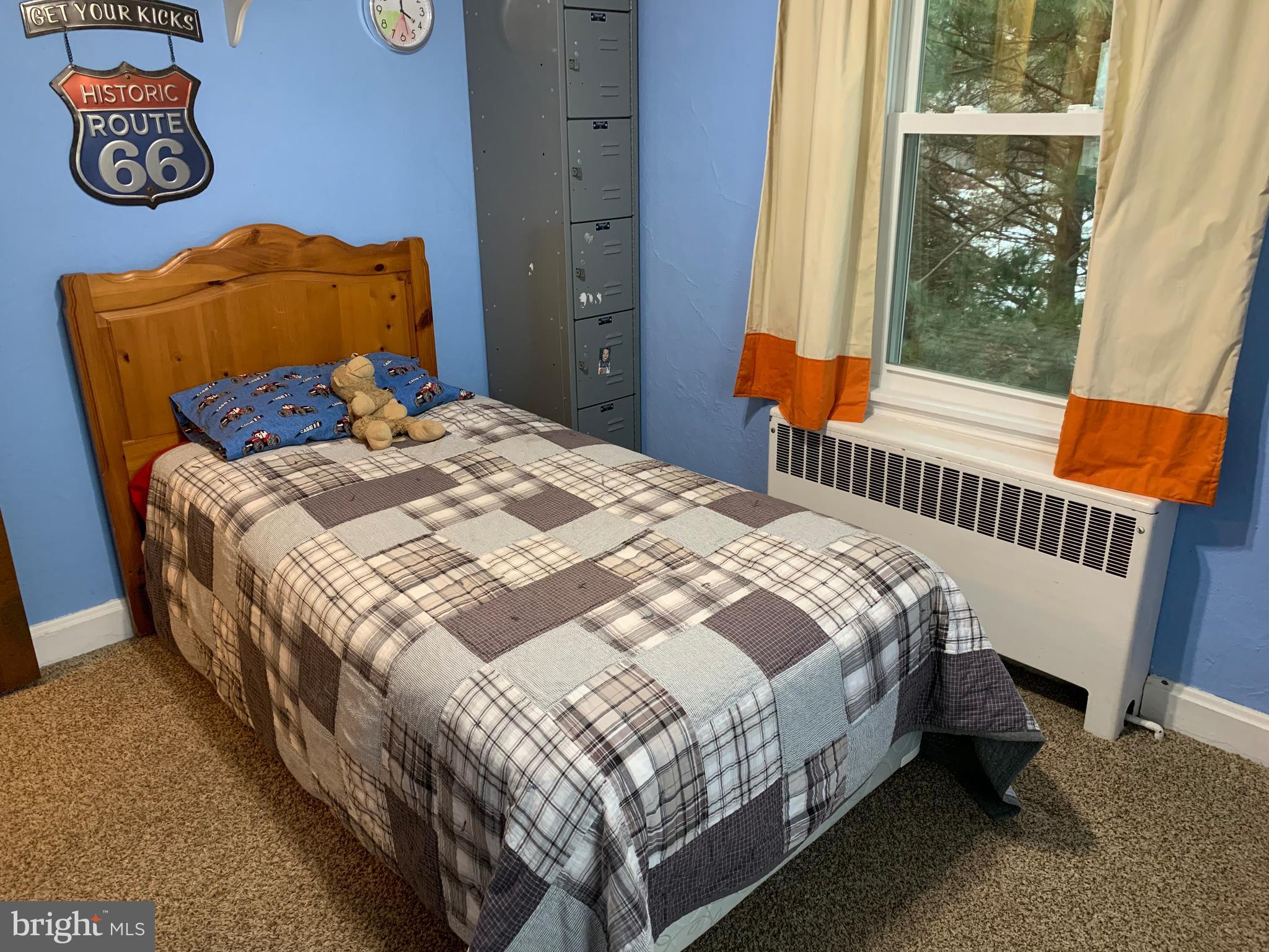 3317 River Road Conestoga, PA 17516 - Photo 14 of 33 a bed sitting in a bedroom next to a window