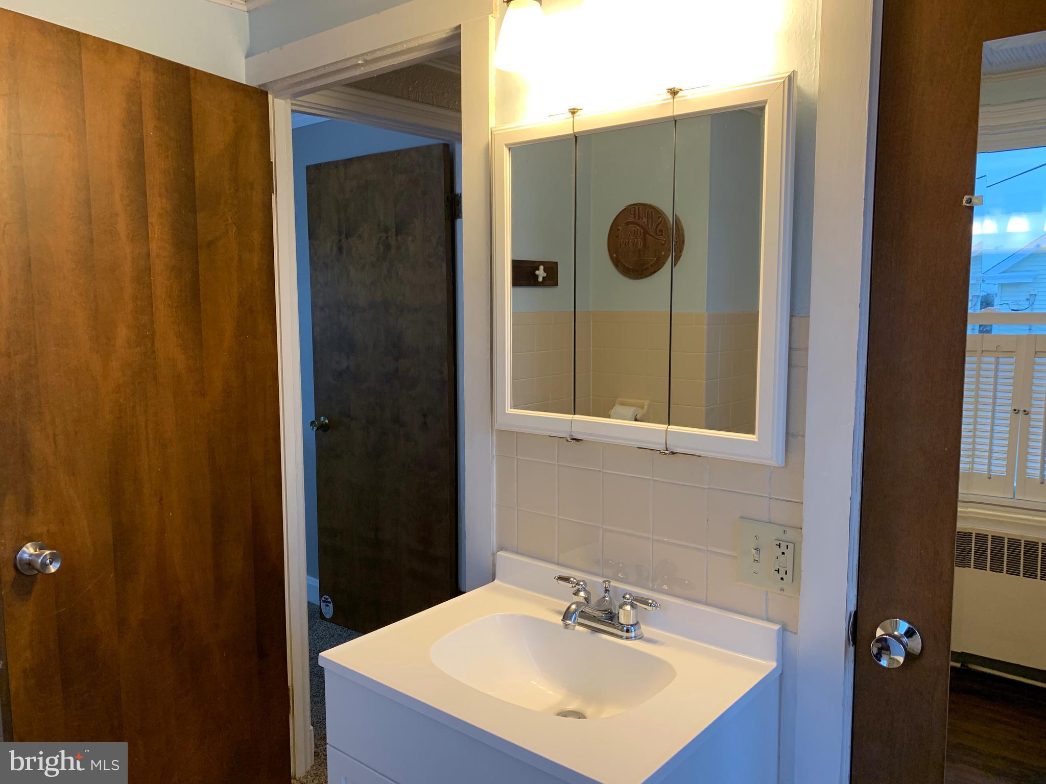 3317 River Road Conestoga, PA 17516 - Photo 16 of 33 a bathroom with a sink and a mirror