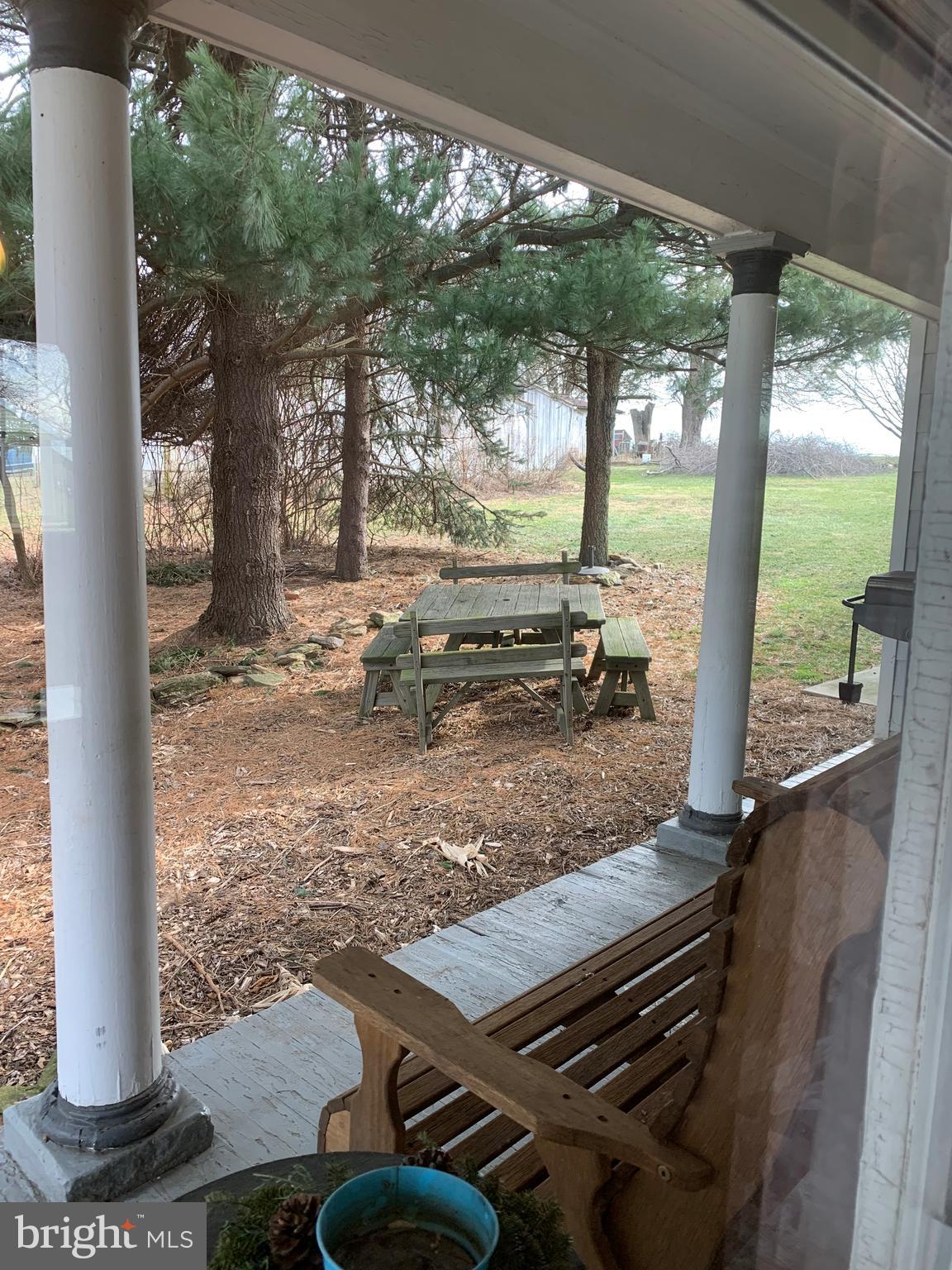 3317 River Road Conestoga, PA 17516 - Photo 27 of 33 a view of a patio with chairs and floor to ceiling window