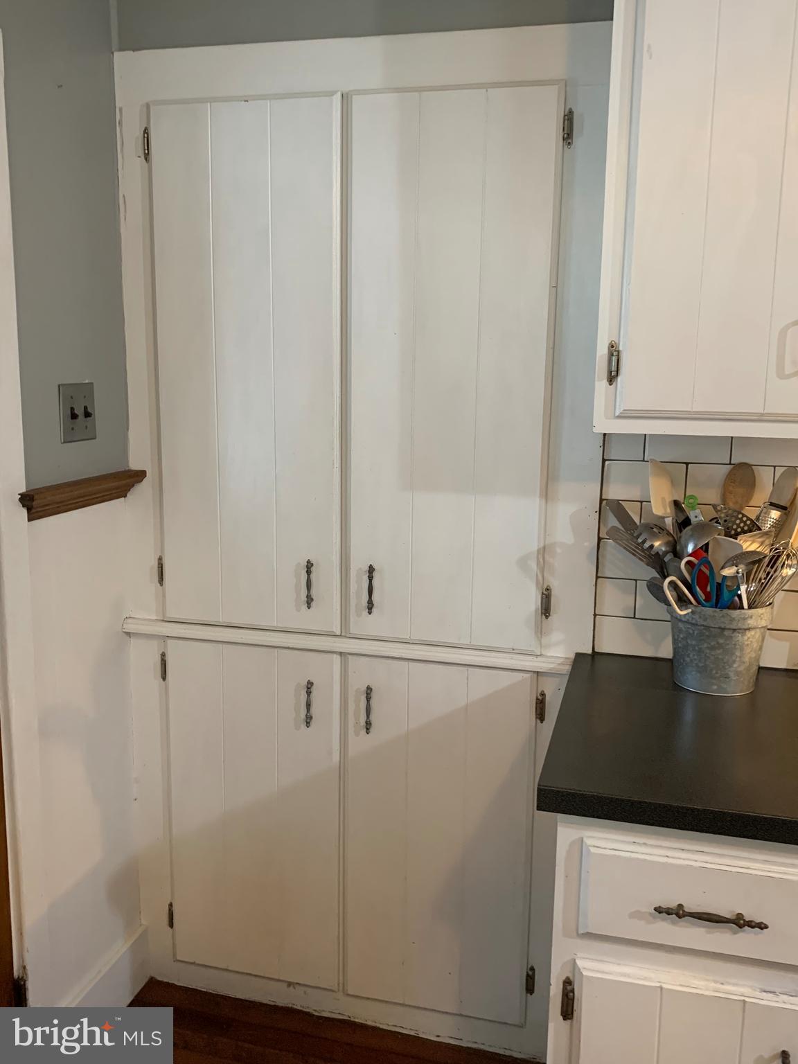 3317 River Road Conestoga, PA 17516 - Photo 5 of 33 a view of a refrigerator a stove and white cabinets