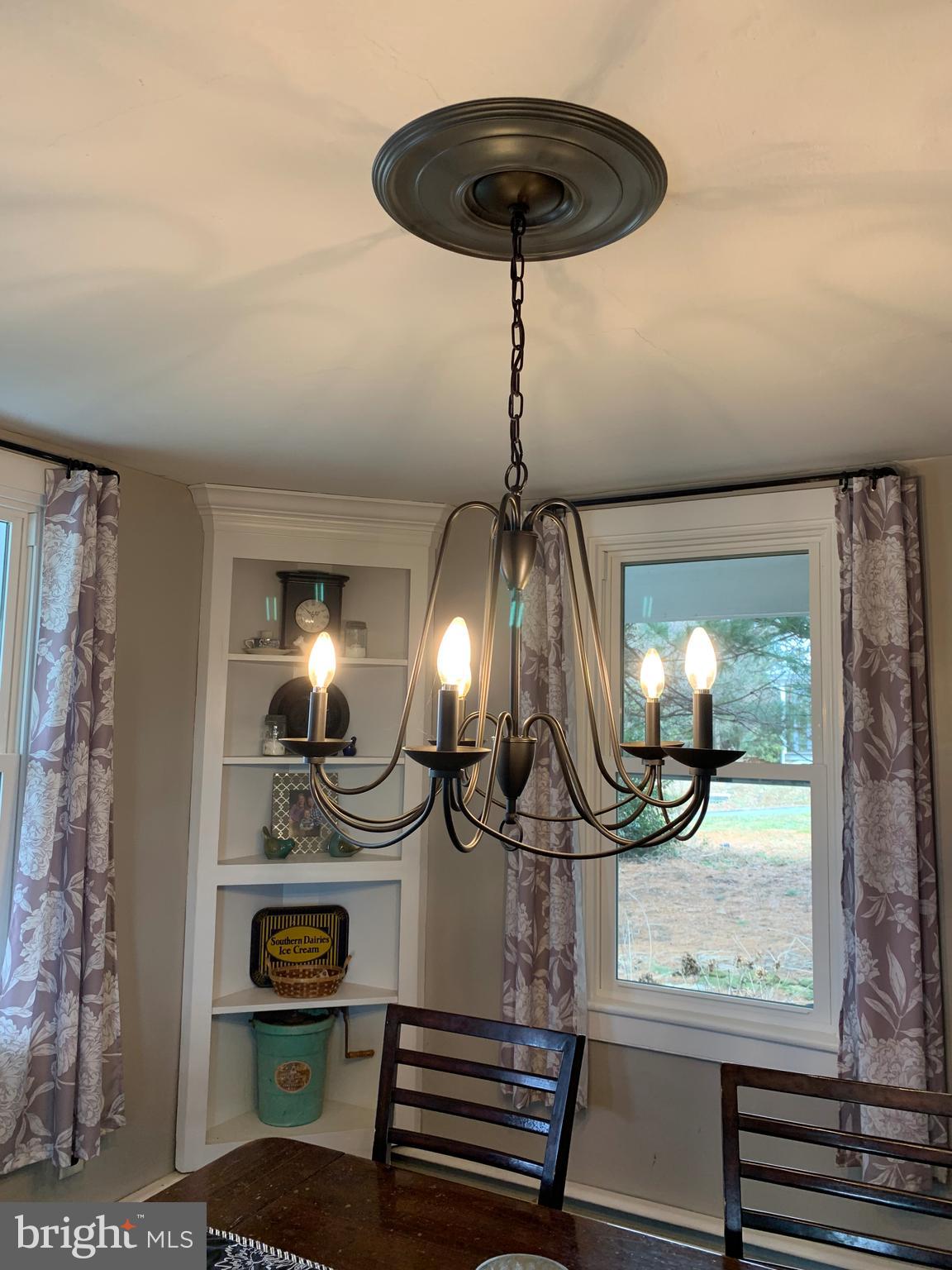 3317 River Road Conestoga, PA 17516 - Photo 8 of 33 a view of a chandelier and wooden floor in a livingroom
