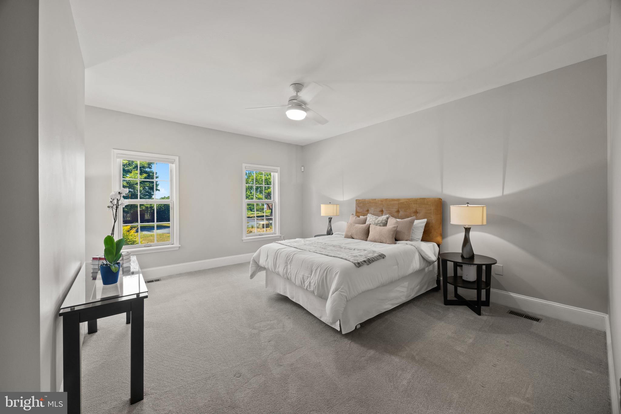 3403 Hidden River View Road Annapolis, MD 21403 - Photo 18 of 50 a spacious bedroom with a bed and a window